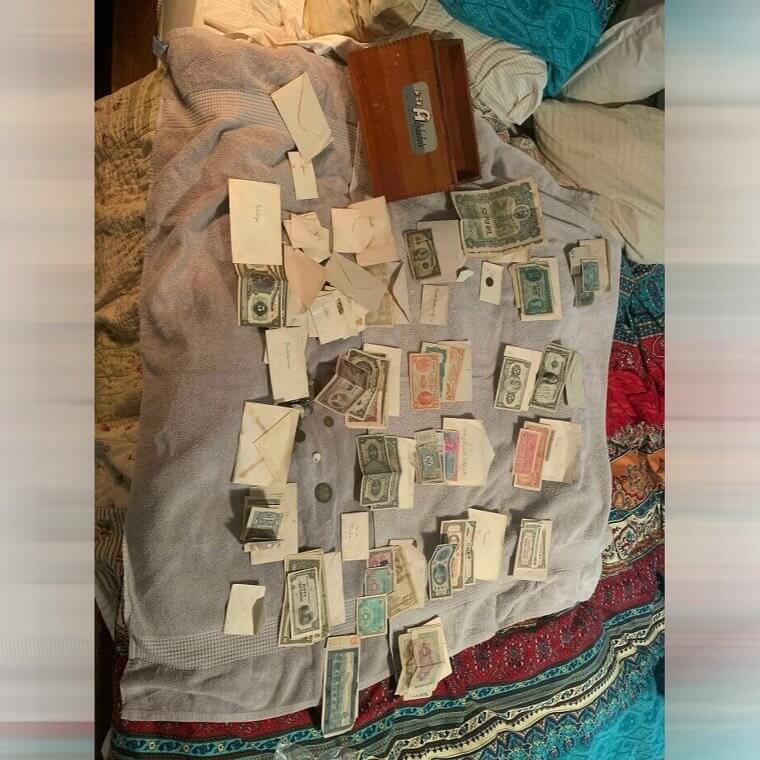 A Box Filled With Antique Coins And Money